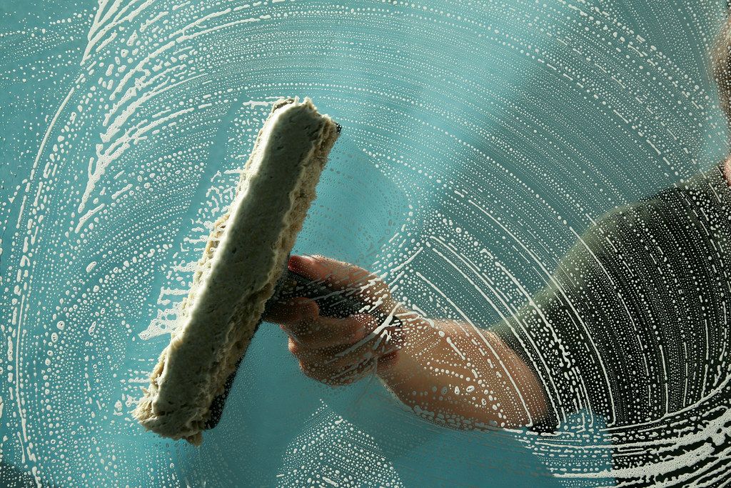 Squeegee on soapy glass